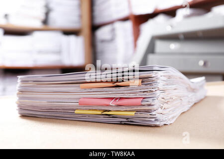 Stack of old paper documents on table in archive Stock Photo