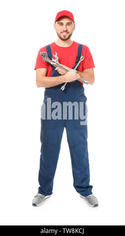 Handsome auto mechanic with tools on white background Stock Photo