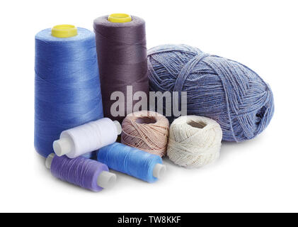 Blue threads of different shades on white background Stock Photo