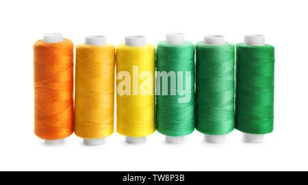 Colorful sewing threads on white background Stock Photo