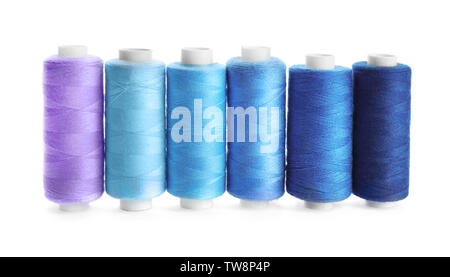 Colorful sewing threads on white background Stock Photo