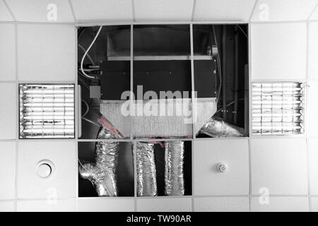 Industrial air conditioner mounted on ceiling indoors Stock Photo