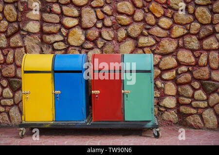 Different colorful trash bins outdoors. Recycling concept Stock Photo