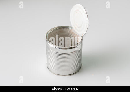 opened tin can on the table without leftovers from the food, meal concervation Stock Photo