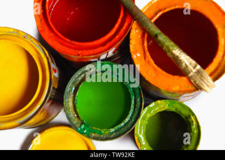 High angle view of open paint cans and a paintbrush Stock Photo
