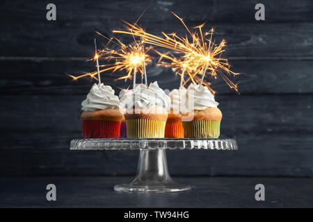 Birthday cupcakes with sparklers on stand Stock Photo