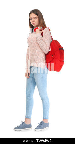 Teenage girl with backpack and headphones on white background Stock Photo