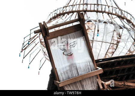 Beautiful Maa Durga Face decorated in a pandal in white cotton sheet and wooden frame on traditional stylish in elegant background for Hindu festival Stock Photo