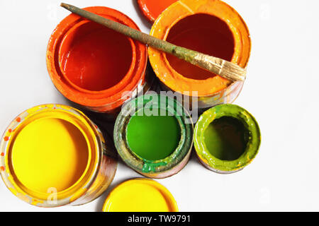 High angle view of open paint cans and a paintbrush Stock Photo