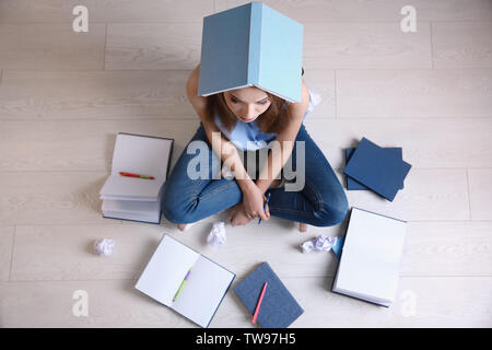 Female student preparing for exam indoors Stock Photo