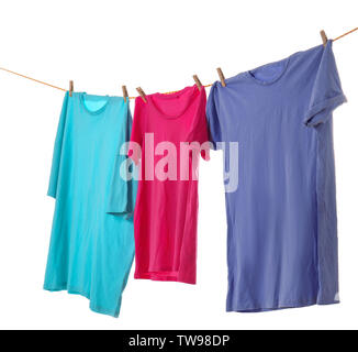 Clothes on laundry line against white background Stock Photo
