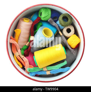 Round box with colorful sewing threads on white background Stock Photo