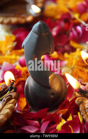 Statue of Lord Ganesha with diwali diyas Stock Photo