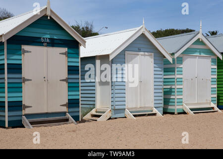 The bright and charming  bathing boxes on Brighton Beach, Victoria (Australia) are an iconic and attract many tourists. Stock Photo