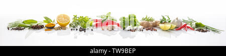 Composition of various herbs and spices on white background Stock Photo