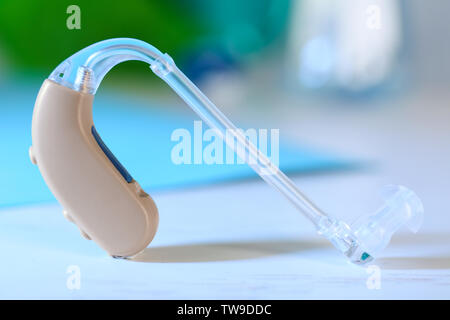 Hearing aid on white table Stock Photo