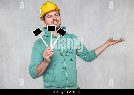 construction worker holding a blackboard with space for text or text, copy space Stock Photo