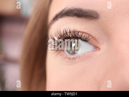 Eye of beautiful young woman with eyelash extensions, closeup Stock Photo