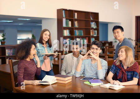 Group of students studying in library Stock Photo
