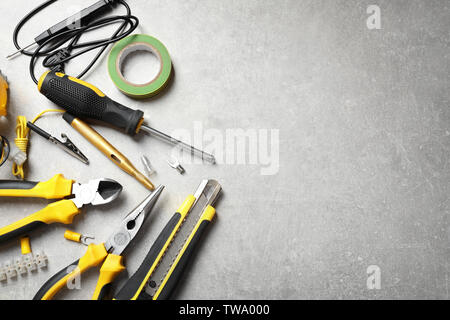 Different electrical tools on grey background Stock Photo