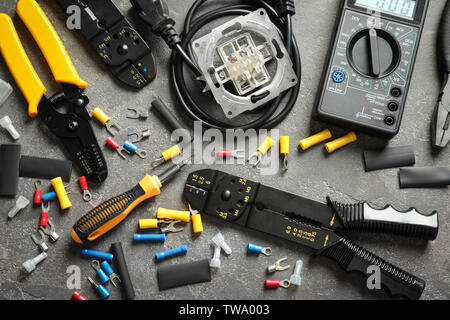 Different electrical tools on grey background Stock Photo