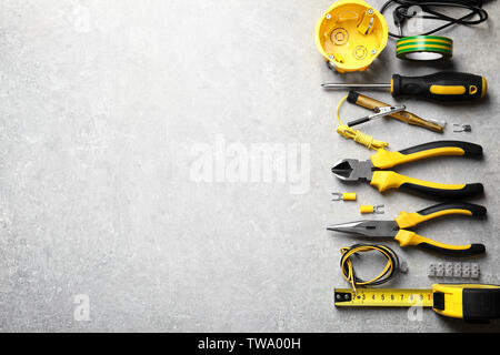 Different electrical tools on grey background Stock Photo