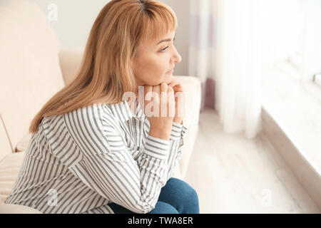 Senior woman in casual clothes at home Stock Photo