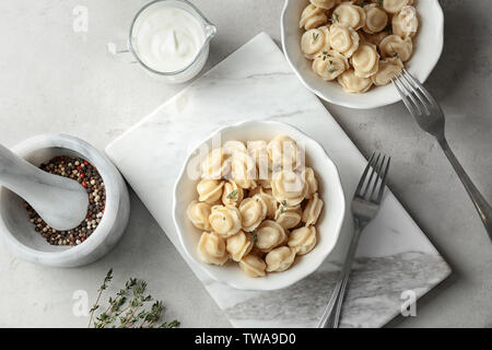 Tasty meat dumplings served for dinner on table Stock Photo