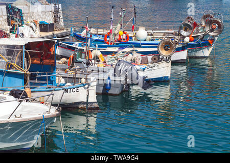 Nice, France - August 13,2018: Small wooden fishing boats moored in old port of Nice city. French Riviera
