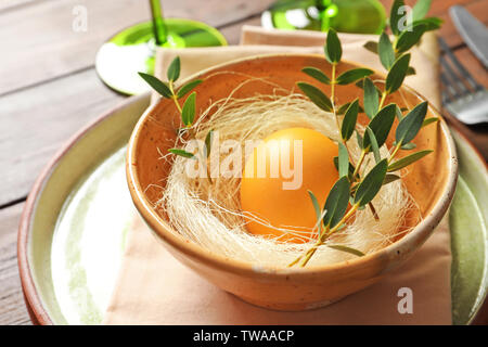 Beautiful festive Easter table setting with painted egg, closeup Stock Photo