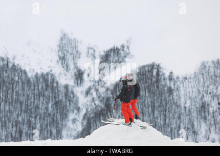 Skiers enjoying the beauty of snowy resort. Winter vacation Stock Photo