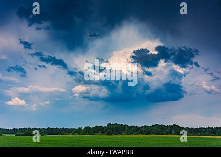 Cumulus storm clouds running across the sky Stock Photo