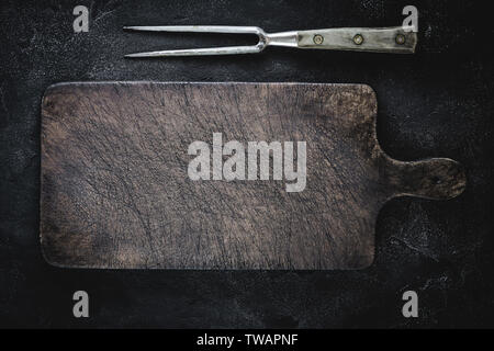 Empty Vintage Brown Chopping Board with Old Fork for Restaurant Menu Stock Photo