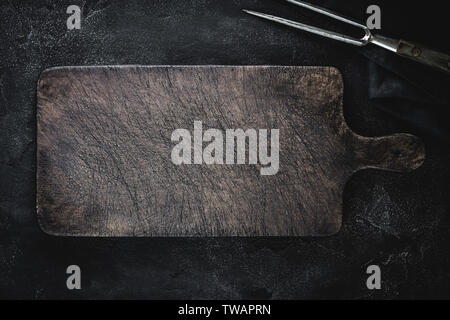 Empty Vintage Brown Chopping Board with Old Fork for Restaurant Menu Stock Photo