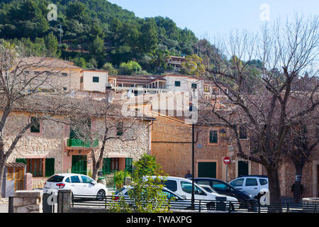 Green mountain and bright houses in Esporles, Mallorca, Spain Stock Photo