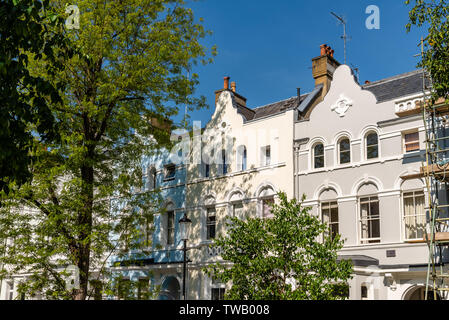 Colourful English Victorian Houses in Notting Hill, a district in West London in the Borough of Kensington and Chelsea Stock Photo