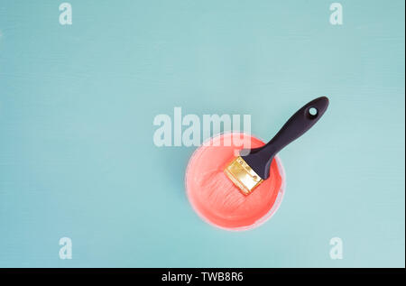 Color of the year 2019. Brush on the can with live coral paint on a light background. minimalism concept Stock Photo