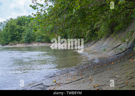 Sloping stony bank of a mountain river. Selective focus.
