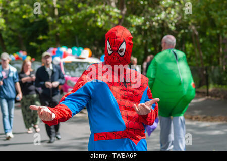 Glasgow, Scotland, UK. 19th June, 2019. Spiderman makes an appearance at The Glasgow Taxi Outing To Troon which this year celebrates it's 74th anniversary. This is an annual outing where over 100 taxi drivers of the city dress up in fancy costumes, decorate their taxis and take more than 300 children with special needs on a day trip to the seaside town of Troon. Credit: Skully/Alamy Live News Stock Photo