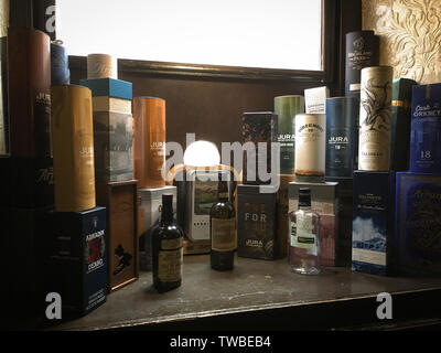 Whisky bottle boxes in Pot Still Bar, Glasgow, Scotland. Stock Photo