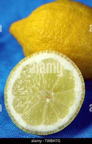 One Whole and Half a Sliced Lemon Stock Photo