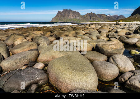 Utakleiv Beach, Lofoten Islands,Norway on a bright spring day. The beach has many large rounded boulders Stock Photo