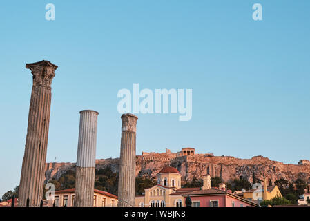 view of temple of the ancient area near Acropolis at sunset from Monastiraki in the capital Greece - Athens Stock Photo