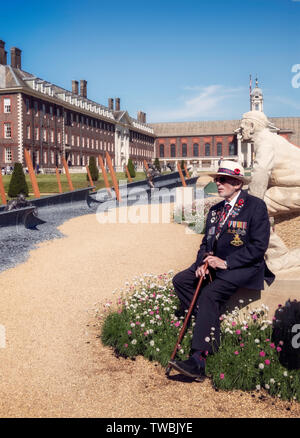 A 96 year old chelsea pensioner seated in front of the D-day garden at the Chelsea Flower Show, London, UK. Stock Photo