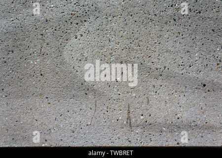 Close-up of textured concrete surface with green steel bands used for ...