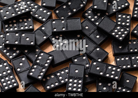 A bunch of domino's scattered across a table top Stock Photo