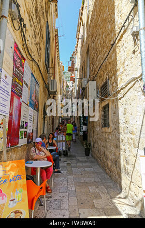One of the many narrow side streets off the Stradum or main street in the old town of Dubrovnik, Croatia Stock Photo