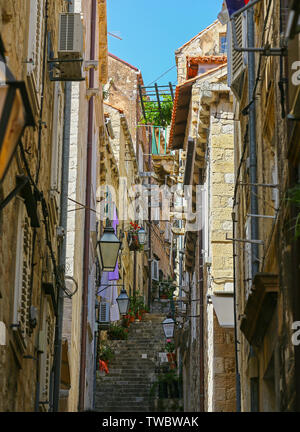 One of the many narrow side streets off the Stradun or main street in the old town of Dubrovnik, Croatia Stock Photo