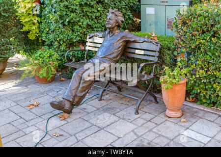 Sedona, AZ - November 22, 2017: Bronze statue of Albert Einstein by Gary Lee Price sits on a bench in the Tlaquepaque Arts & Shopping Village. Stock Photo