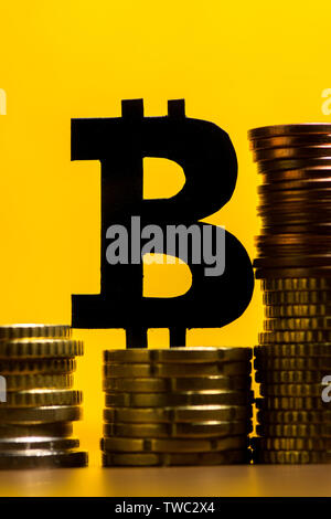 A closeup of yellow and red coins Stock Photo - Alamy